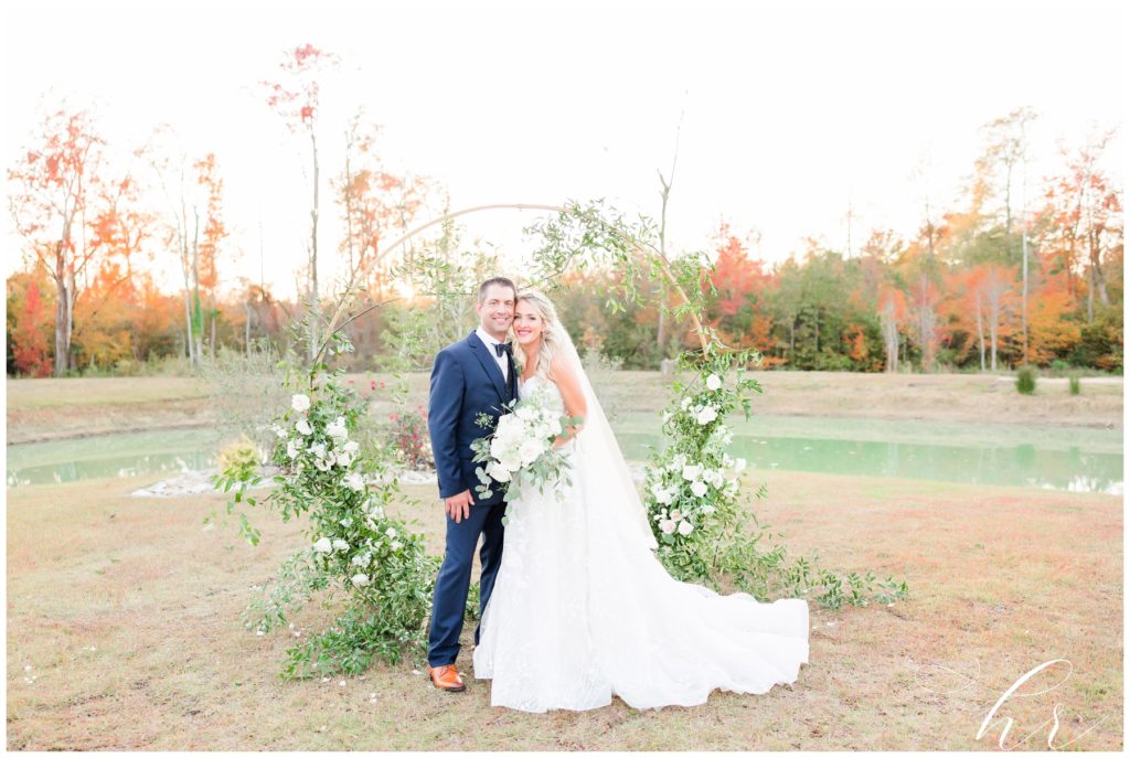 beautiful bride and groom on wedding day with florals