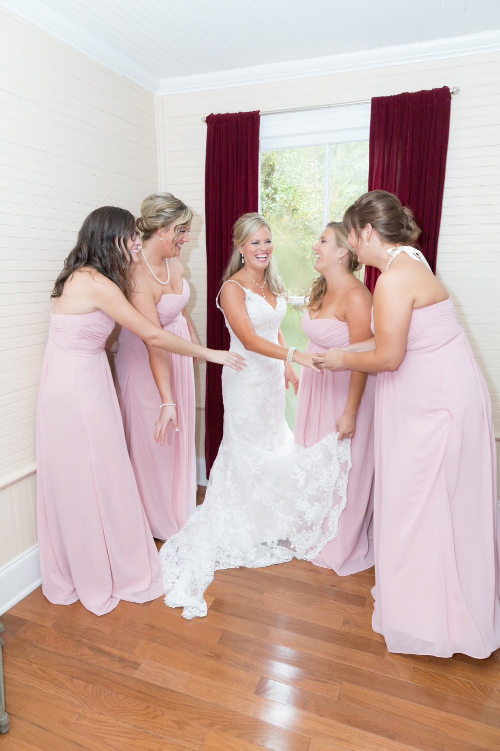 Bride getting ready with her bridesmaids 