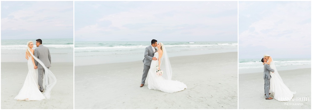 Cotton candy skies with bride and groom on beach