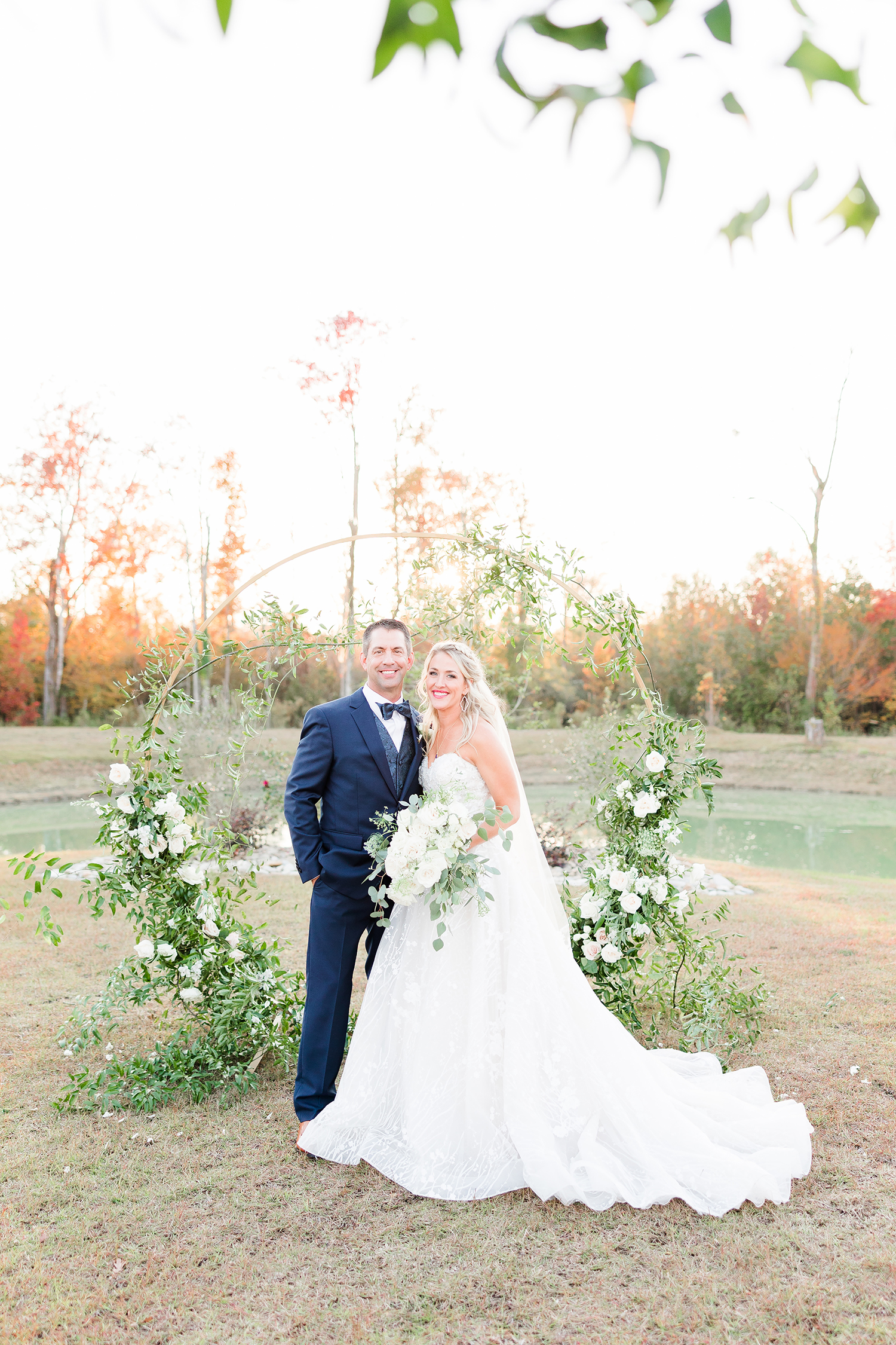 Greenery surrounded bride and groom portraits
