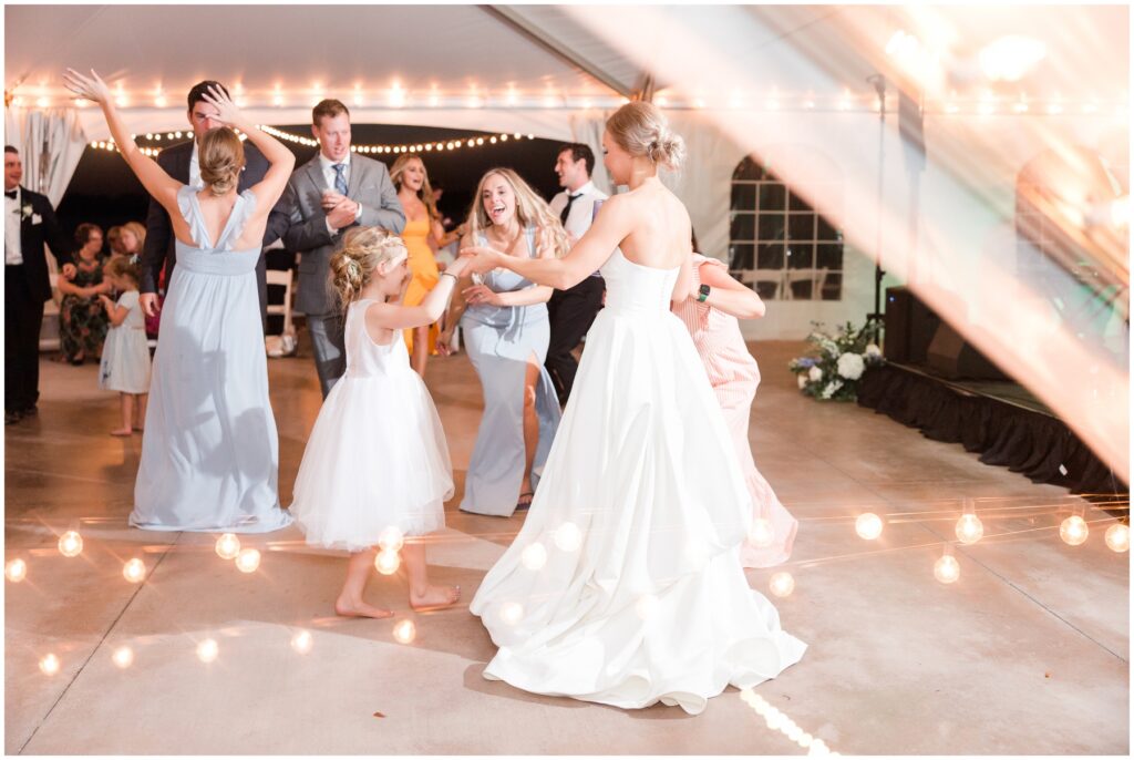 Dancing at reception under white tent 