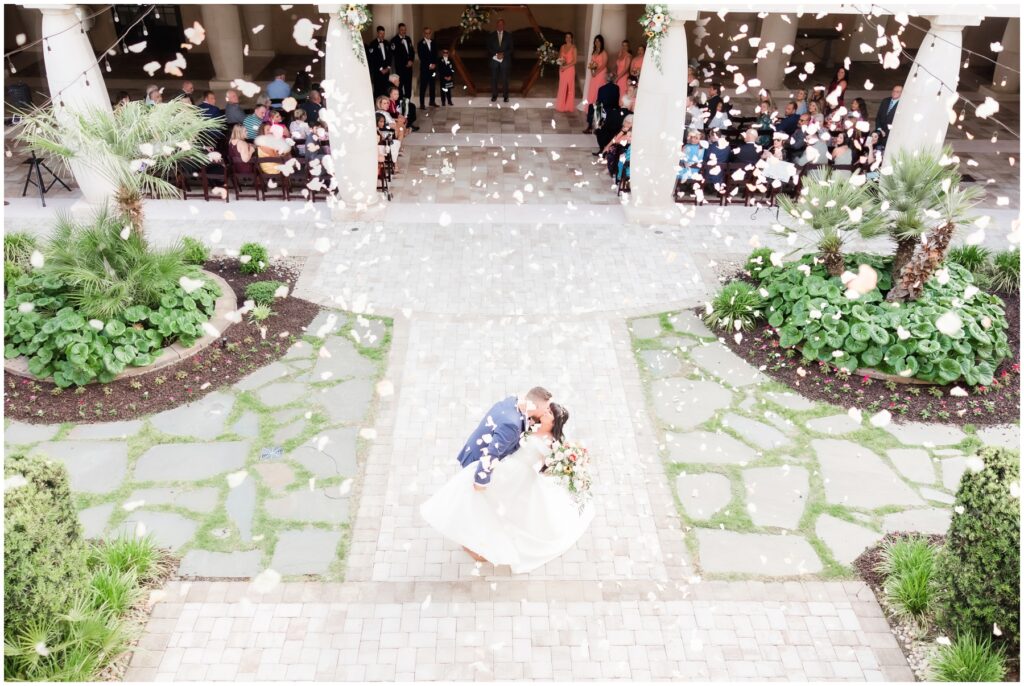 flower canon in courtyard at 21 Main events at north beach - wedding day kiss