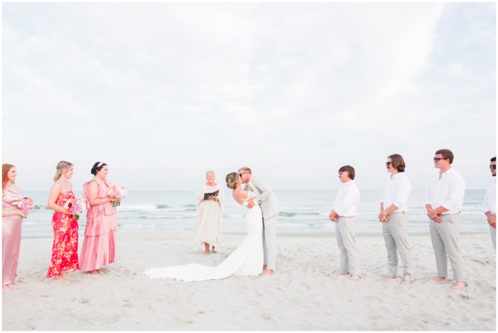 Small, Intimate Myrtle Beach Wedding on the beach - cotton candy skies - Groom and Bride Kissing
