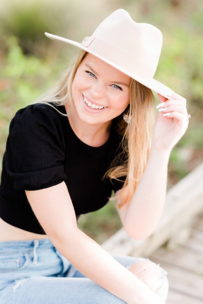 Senior Photography of girl holding her hat