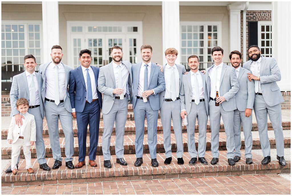 Large bridal party of handsome men