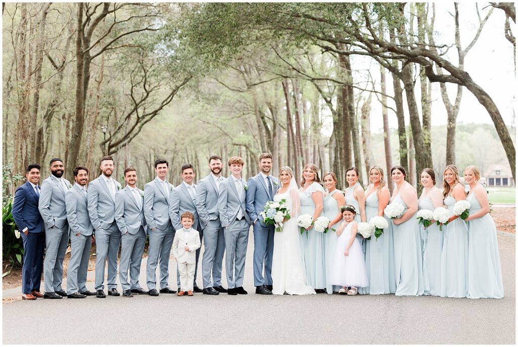 large bridal party in blues 