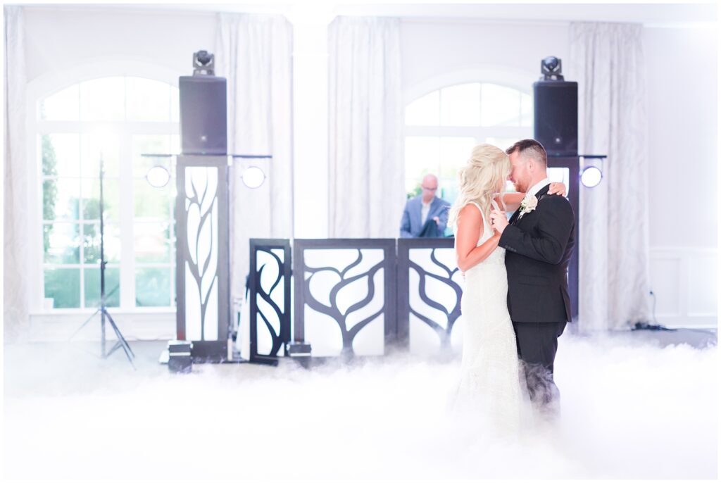 bride and groom dancing on a cloud