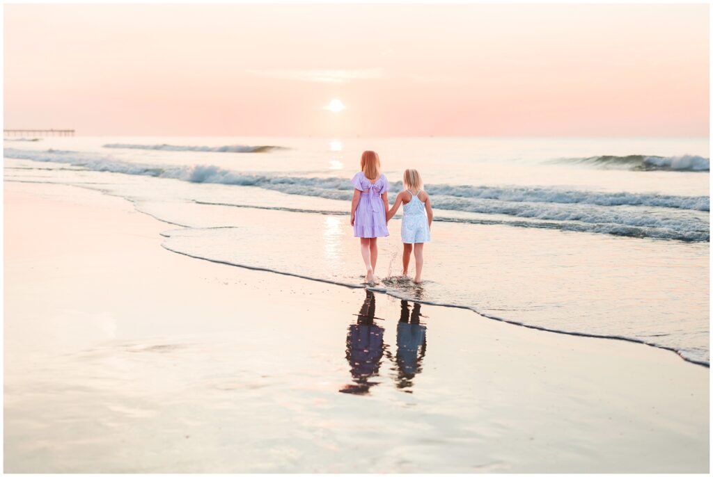 girls walking during sunrise photoshoot in myrtle beach