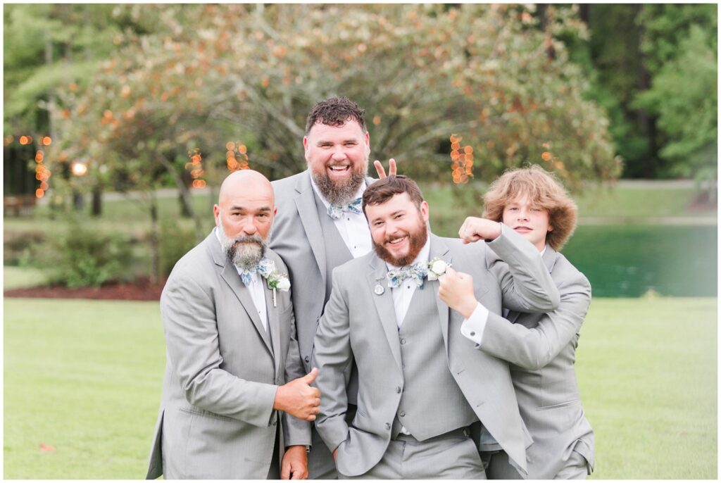 Groomsmen and groom on wedding day, grey suites. 