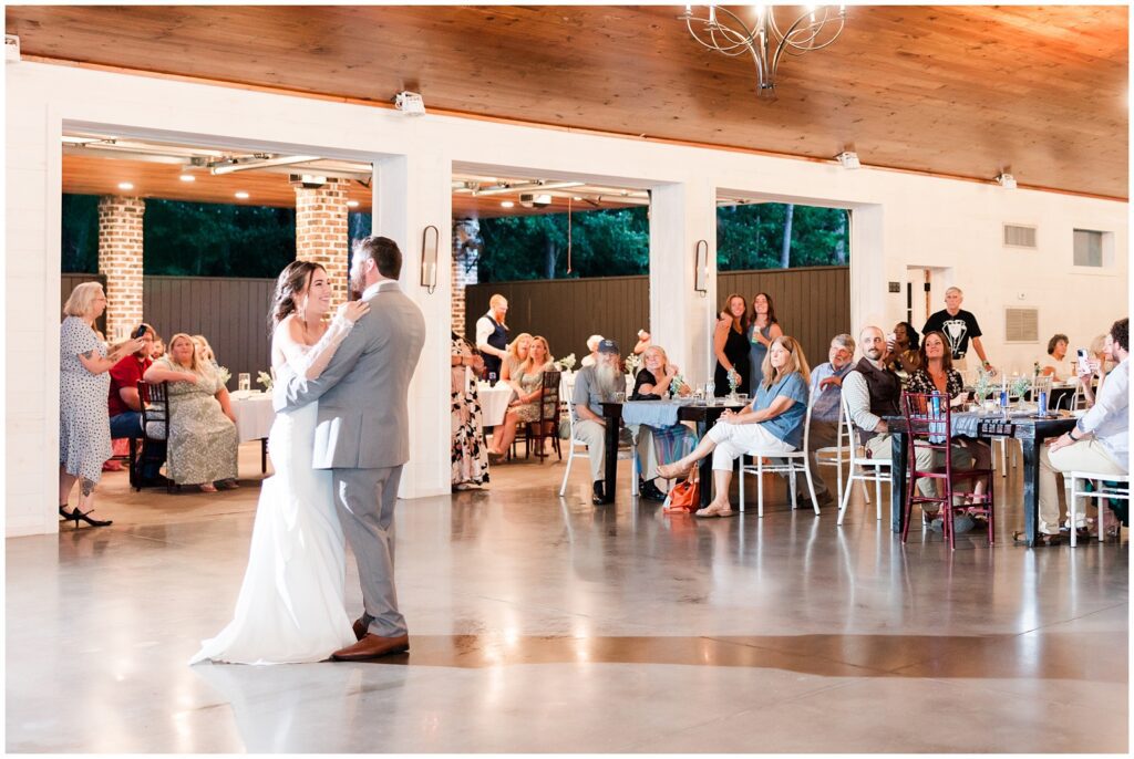 The bride and groom dance in the barn during the first dance. Marion, South Carolina weddings. 