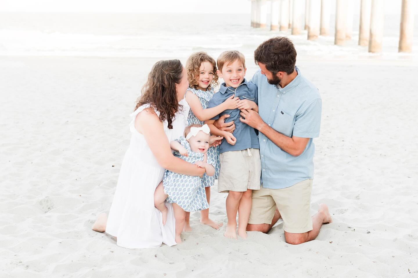 family on the beach for photos in myrtle beach