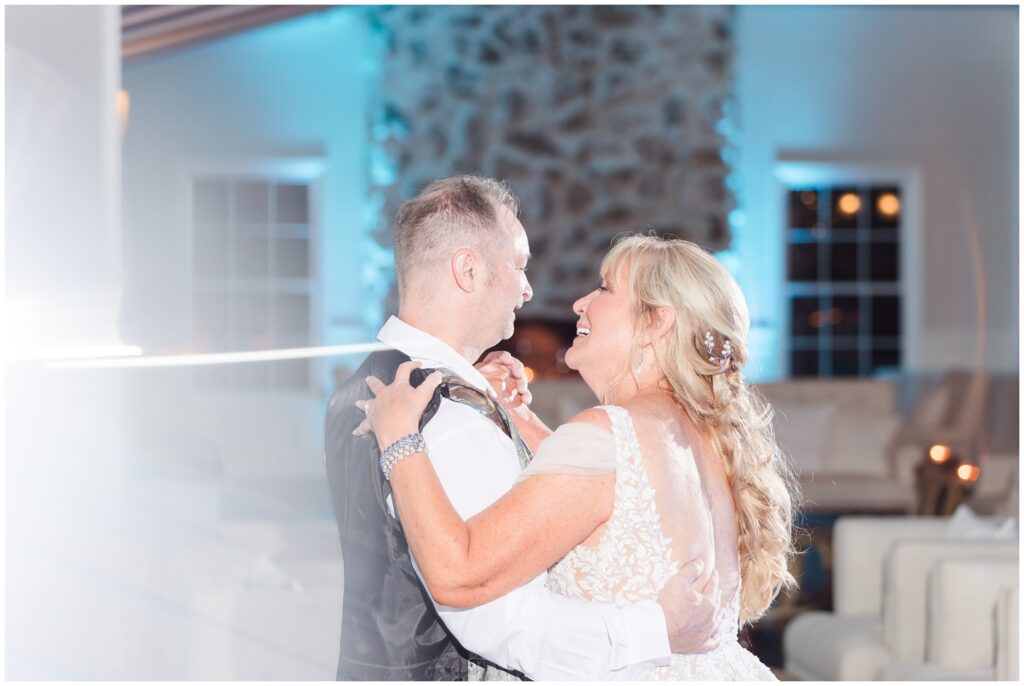 Bride and groom in love dancing at the village house in Pawleys island on wedding day. 