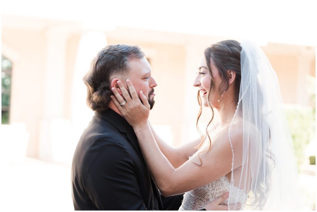 Emotional first look on wedding day in the courtyard at 21 Main Events 