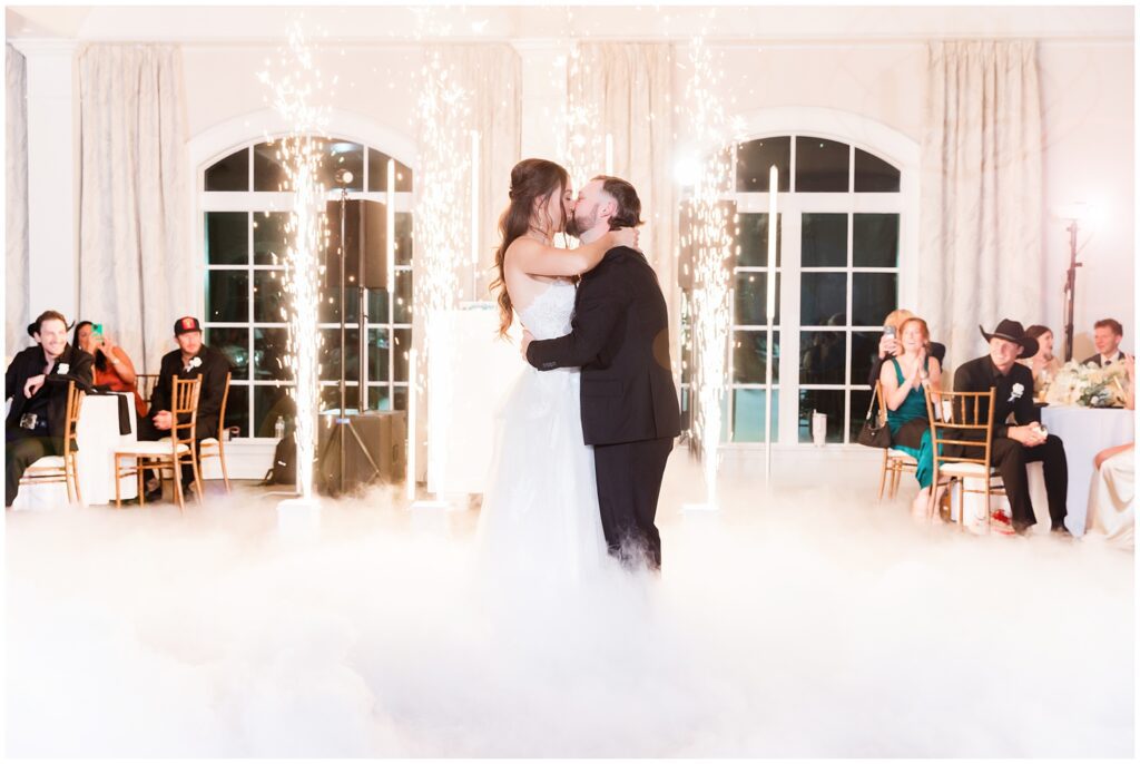 First dance at reception with clouds and sparks