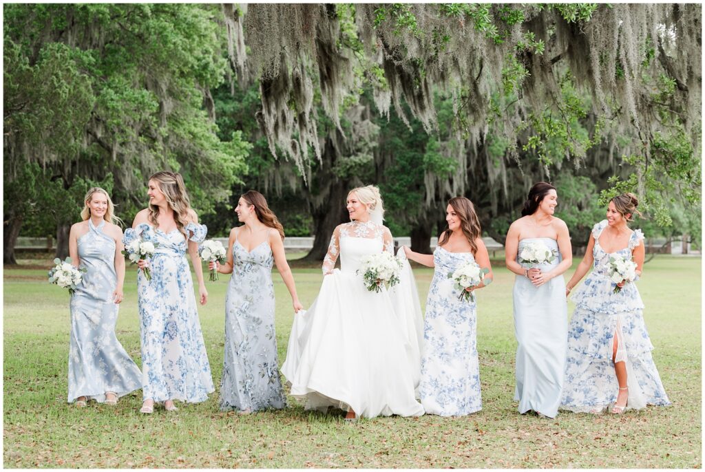Bridesmaids wearing dusty blue gowns for spring wedding at Middleton Place Charleston