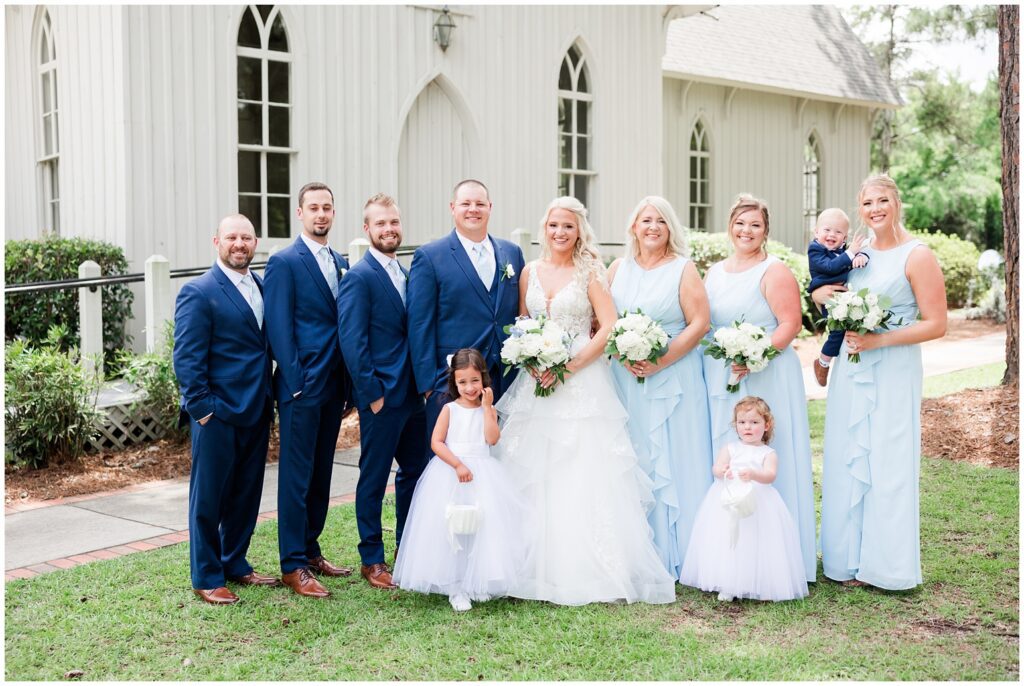 A Florence - South Carolina Wedding bridal party posing outisde church