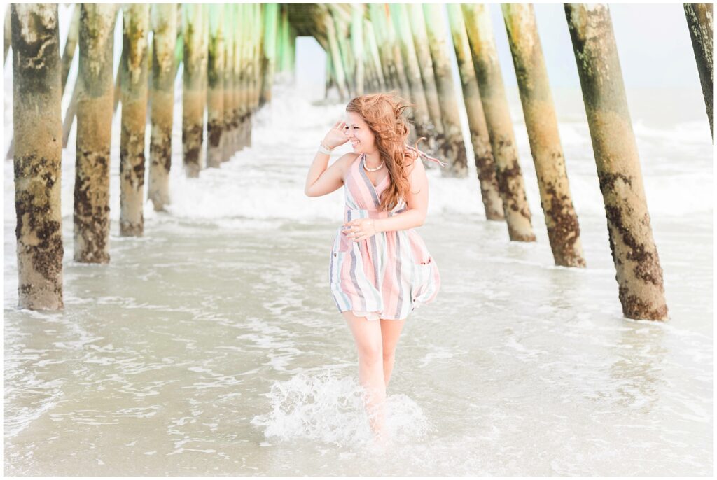 Family photography at Myrtle Beach State Park with pier in the background
