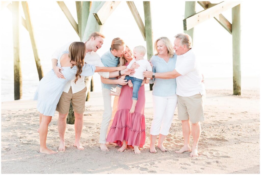 Photographer capturing portraits near Garden City Pier with coastal charm