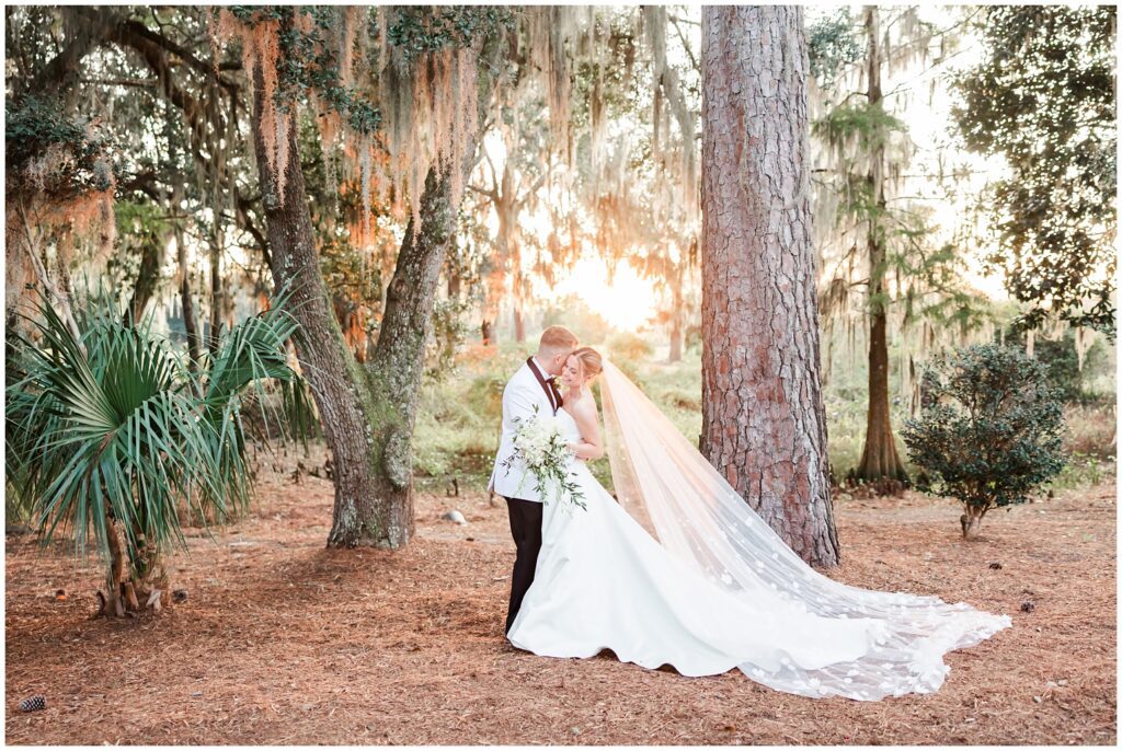 Bride and groom under live oak trees at The Heritage Club Pawleys Island”